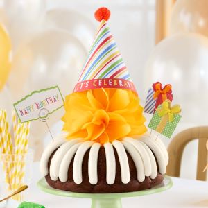 Birthday cake with balloon in the background