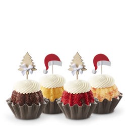 Each Bundtini® is adorned with a festive topper: two feature silver Christmas tree decorations and the other two have red Santa hats.