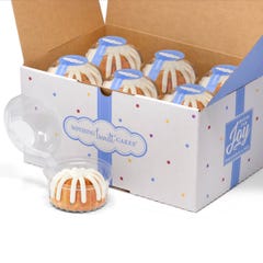A box filled with 12 individually packaged Confetti bundtlets. 