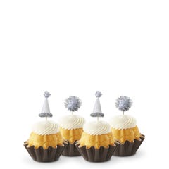 Lemon mini Bundt cakes (Bundtinis®) each topped with creamy white frosting and adorned with silver party hats and matching silver pom-poms.