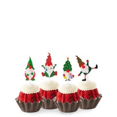 Red Velvet mini bundt cakes topped with four Christmas-themed gnome decorations: one in green with a mistletoe, one in red with a tree, one in stripes with a gift, and one in red and white.